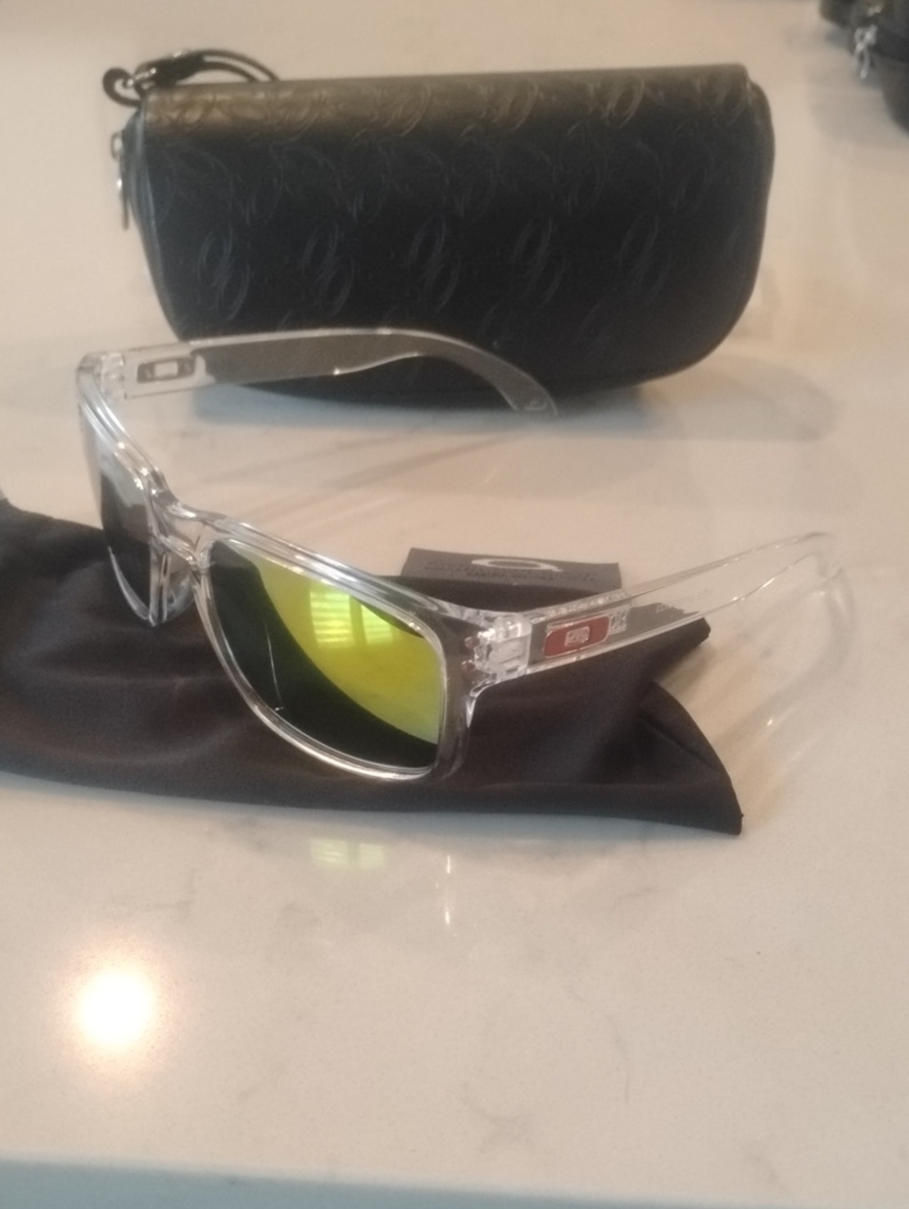 Oakley Clear Frame Sunglasses with Yellow Mirror Lenses and Black Case